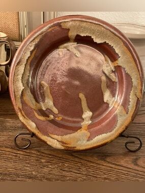Handmade stoneware plate or shallow bowl. Rust with beige and cream glazed.